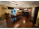 Eat-in kitchen boasts stainless appliances, a central island, and an adjacent dining area with hardwood floors at 5456 Thunderidge Dr, Raleigh, NC 27610