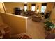 Spacious living room featuring neutral carpet, a television, multiple windows and comfortable seating at 5456 Thunderidge Dr, Raleigh, NC 27610