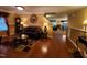 Comfortable living room with carpet, a dark brown leather sofa, and a round mirror above it at 5456 Thunderidge Dr, Raleigh, NC 27610