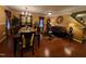 Elegant living and dining area featuring hardwood floors, formal furniture, and sophisticated decorative accents at 5456 Thunderidge Dr, Raleigh, NC 27610