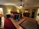 Large primary bedroom suite features hardwood floors, a ceiling fan, and workout equipment at 5456 Thunderidge Dr, Raleigh, NC 27610