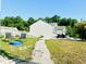 Backyard featuring green grass, chairs, a pool, and an easy to follow stone path at 5849 Ricker Rd, Raleigh, NC 27610