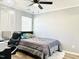 Comfortable bedroom with a ceiling fan and a window providing natural light at 5849 Ricker Rd, Raleigh, NC 27610