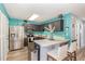Modern kitchen with stainless steel appliances, a center island, and sleek countertops at 5849 Ricker Rd, Raleigh, NC 27610