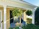 Cozy front porch featuring hanging ferns and a seating area, perfect for relaxing outdoors at 5849 Ricker Rd, Raleigh, NC 27610