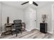 Neutral toned bedroom features a ceiling fan, desk and chair, and an additional lamp on a side table at 709 Brighton Rd, Raleigh, NC 27610
