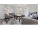 Comfortable living room with gray sofas, modern coffee table, and natural light at 709 Brighton Rd, Raleigh, NC 27610