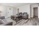 Cozy living room featuring gray sofas, and a unique coffee table at 709 Brighton Rd, Raleigh, NC 27610