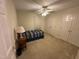This bedroom offers a ceiling fan, double closets, neutral carpet and a cozy area for relaxation at 7194 Johns Point Ct, Liberty, NC 27298