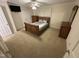 Bedroom with carpeted floors, ceiling fan, and wooden furniture set at 7194 Johns Point Ct, Liberty, NC 27298