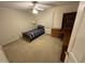 This bedroom features a twin bed, a ceiling fan, and a corner desk with drawers for ample storage at 7194 Johns Point Ct, Liberty, NC 27298