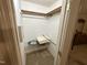 Walk in closet with shelves, wire racks, and space for storage at 7194 Johns Point Ct, Liberty, NC 27298