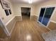 Dining area with light hardwood floors, and sliding glass doors leading to deck at 7194 Johns Point Ct, Liberty, NC 27298