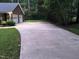 View of the long driveway leading to the house and attached two car garage at 7194 Johns Point Ct, Liberty, NC 27298
