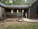 Charming brick home with a welcoming front porch and landscaped front yard at 7194 Johns Point Ct, Liberty, NC 27298
