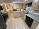 Kitchen features stainless steel appliances, granite countertops, and light wood cabinetry at 7194 Johns Point Ct, Liberty, NC 27298