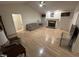 Spacious living room featuring hardwood floors, a ceiling fan, and a cozy fireplace at 7194 Johns Point Ct, Liberty, NC 27298