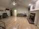 Bright and spacious living room featuring hardwood floors and a fireplace at 7194 Johns Point Ct, Liberty, NC 27298