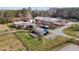 Aerial view of a stunning property with main house, horse stables, pastures, sheds, and ample land and privacy at 756 Epps Clark Rd, Siler City, NC 27344
