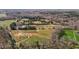 Overhead image of a countryside estate with fields, wooded areas, outbuildings and winding driveways at 756 Epps Clark Rd, Siler City, NC 27344
