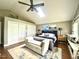 Comfortable primary bedroom features hardwood floors, skylight, and neutral paint at 756 Epps Clark Rd, Siler City, NC 27344