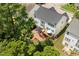 Aerial view showcases the deck and backyard, surrounded by lush greenery, creating a private outdoor space at 8106 Sommerwell St, Raleigh, NC 27613