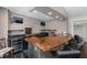 Stylish bar area with seating, a wine fridge, and countertop, offering a sophisticated entertainment space at 8106 Sommerwell St, Raleigh, NC 27613