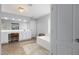 Bright bathroom featuring a double vanity, soaking tub, and neutral decor, providing a serene and relaxing atmosphere at 8106 Sommerwell St, Raleigh, NC 27613