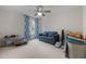 Versatile bedroom, great for relaxation or hobbies, featuring a cozy couch and ample space for personalization at 8106 Sommerwell St, Raleigh, NC 27613