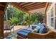 Relaxing outdoor space with deck furniture, and views of the surrounding lush greenery and lake at 8106 Sommerwell St, Raleigh, NC 27613