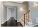 Welcoming entryway features hardwood floors, a staircase, and natural light, creating a warm and inviting ambiance at 8106 Sommerwell St, Raleigh, NC 27613