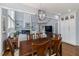 Open floor plan with an adjacent living room and dining room with fireplace at 8106 Sommerwell St, Raleigh, NC 27613