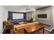 Relaxing living area featuring a large projector screen, plush seating, and modern entertainment setup for ultimate comfort at 8106 Sommerwell St, Raleigh, NC 27613