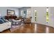 Cozy living room featuring hardwood floors, comfortable seating, a rug, and a welcoming atmosphere at 8106 Sommerwell St, Raleigh, NC 27613