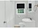 Bathroom featuring a shower, window, sink with vanity and toilet at 827 Union St, Cary, NC 27511