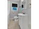 Bathroom featuring a shower, window, sink with vanity and toilet at 827 Union St, Cary, NC 27511