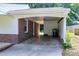 Carport with brick pillars, access door and storage area at 827 Union St, Cary, NC 27511