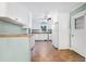 Bright kitchen features white cabinets, appliances, and a window overlooking the backyard at 827 Union St, Cary, NC 27511