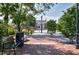 View of a downtown area with well-maintained sidewalks, benches, and mature trees at 827 Union St, Cary, NC 27511