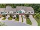 Overhead view of brick townhomes with individual driveways, surrounded by lush trees at 927 Contessa Dr, Cary, NC 27513