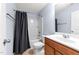 Clean bathroom featuring a shower-tub combo, vanity with sink, and modern fixtures at 927 Contessa Dr, Cary, NC 27513