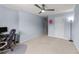 Spacious bedroom with a modern ceiling fan, neutral carpet, and ample natural light at 927 Contessa Dr, Cary, NC 27513