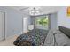 Comfortable bedroom featuring a large window and modern light fixture above at 927 Contessa Dr, Cary, NC 27513