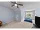Bright bedroom featuring a window view, neutral carpet, and ample natural light at 927 Contessa Dr, Cary, NC 27513