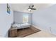 Cozy bedroom with a ceiling fan, window view, neutral carpet, and natural light at 927 Contessa Dr, Cary, NC 27513