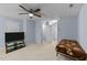 Large bedroom featuring a ceiling fan, neutral carpet, and ample natural light at 927 Contessa Dr, Cary, NC 27513