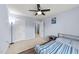 Comfortable bedroom featuring a ceiling fan, neutral carpet, and ample natural light at 927 Contessa Dr, Cary, NC 27513
