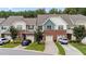 Attractive townhome with brick accents, individual driveways, and lush green lawns at 927 Contessa Dr, Cary, NC 27513