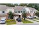 Charming townhome featuring a brick facade, attached garage, and well-maintained landscaping at 927 Contessa Dr, Cary, NC 27513