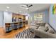 Open living space features kitchen with island seating, a comfortable sofa, and an open floor plan at 927 Contessa Dr, Cary, NC 27513